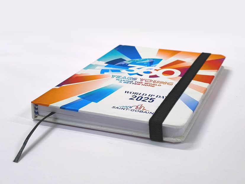 Angled view of the diary showing the hardcover thickness and bookmark thread.