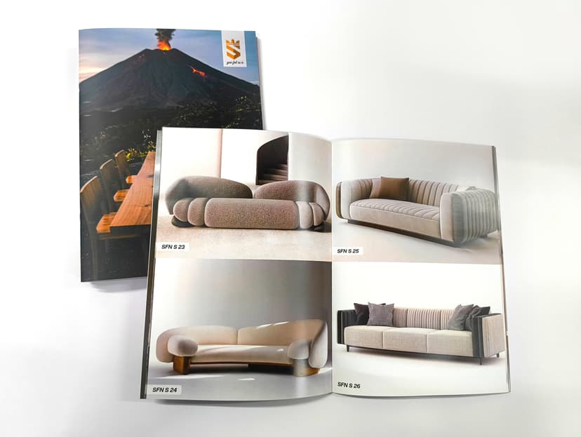 Opened catalogue showing high-quality full-colour interior spreads.