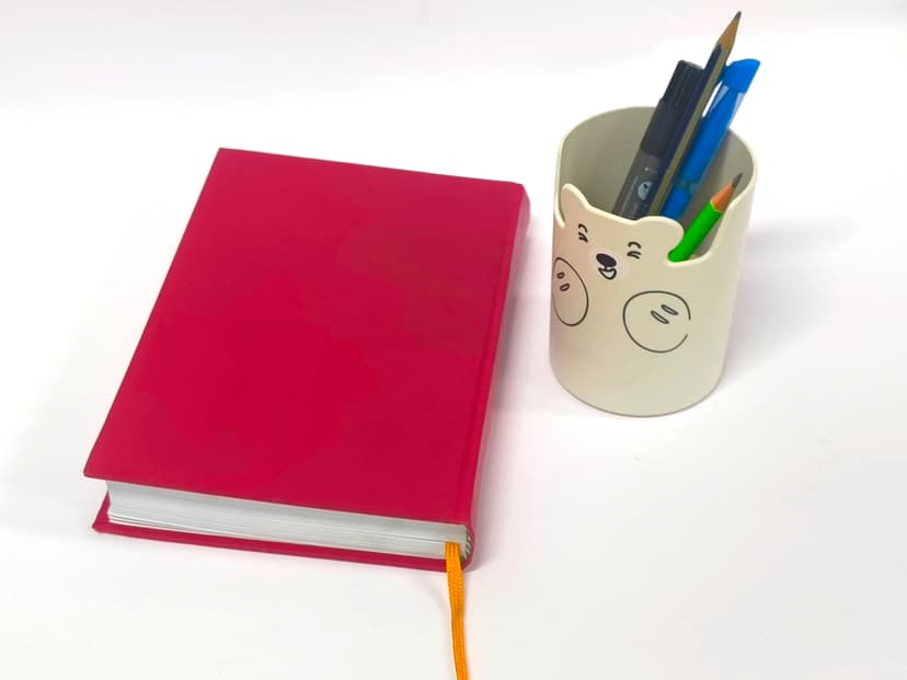 Side view of the book highlighting the professional curved spine and yellow bookmark.