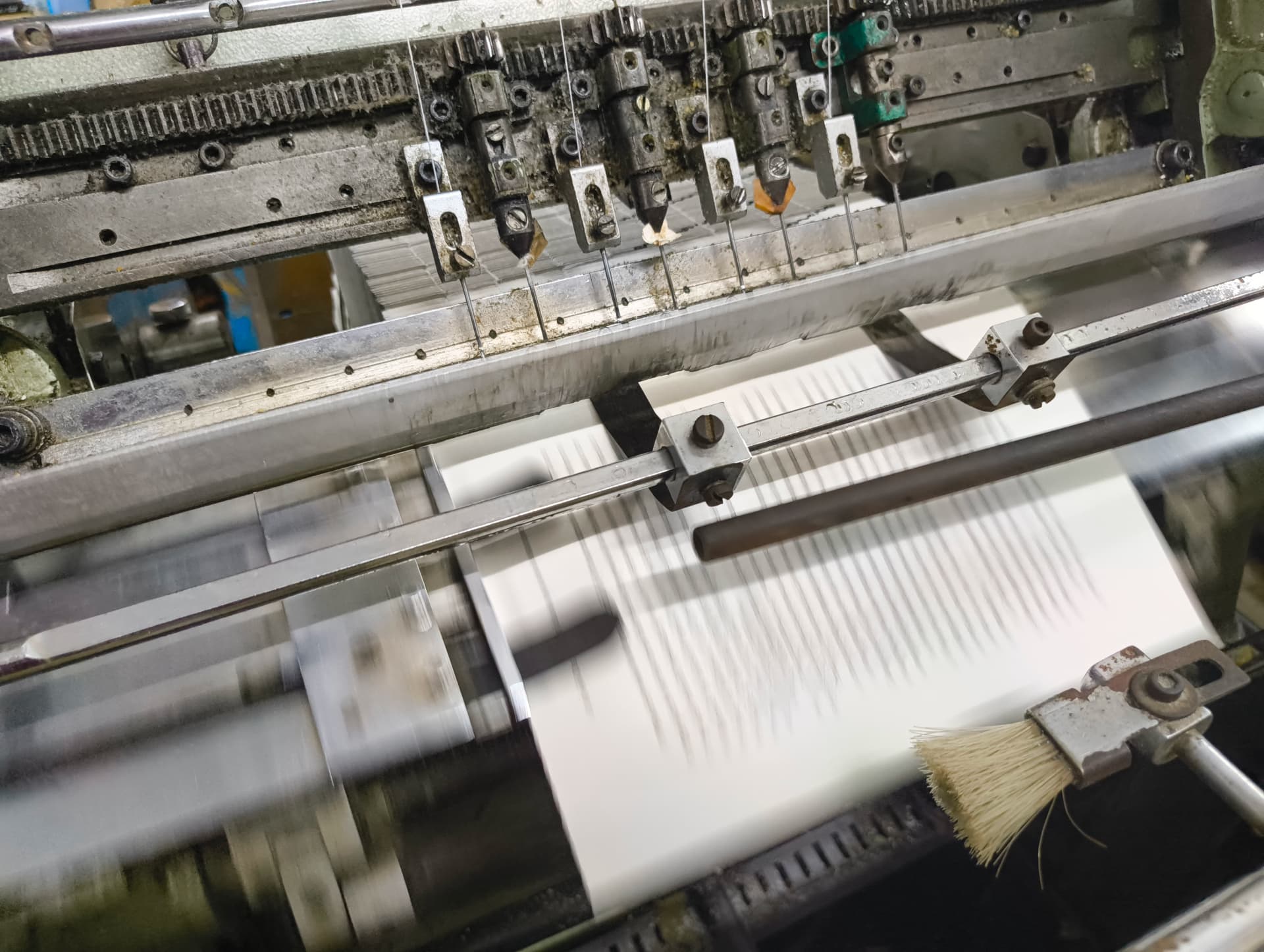 Sheets being section-sewn on the binding line at VST