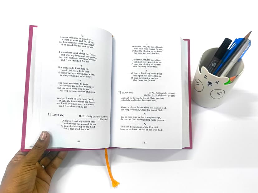 Opened luxury book showing crisp interior text and section sewing.