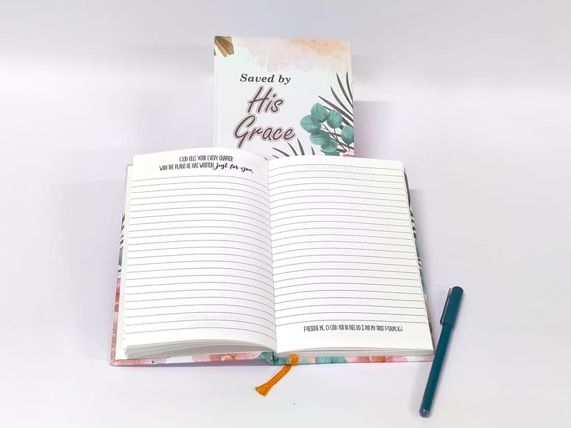 Fully opened journal with a pen, highlighting the lay-flat writing surface.