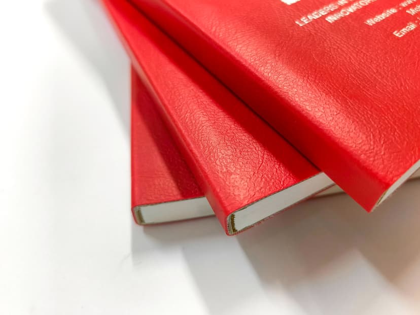 Macro shot of the rexine texture and the clean edge finishing of the cover.